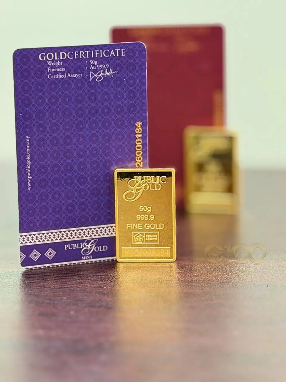 Gold certificate 50 gram Public Gold bersama kepingan gold bar 999.9 fine gold sebagai simpanan yang dikira nisab zakat emas
